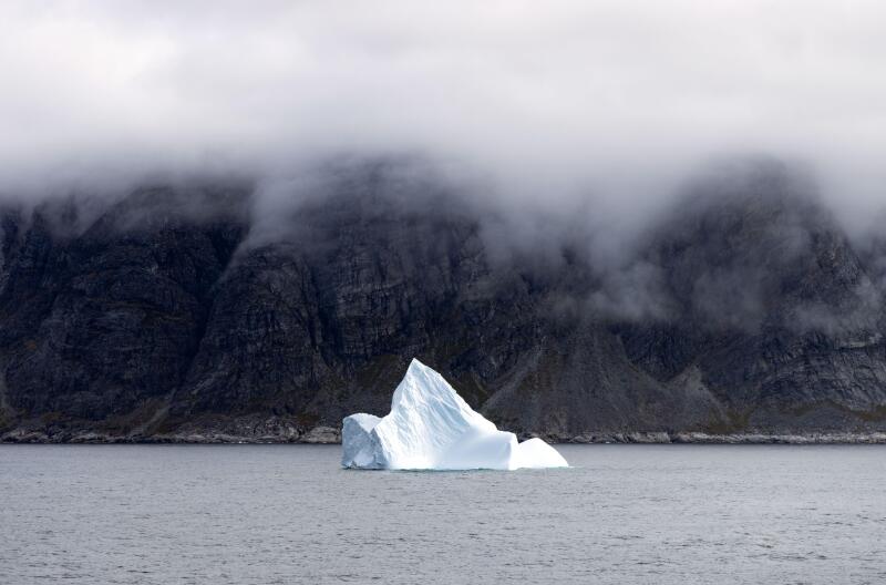 Greenland iceberg - one iceberg in a Greenland fjord, southern Greenland landscape, Arctic, Europe.