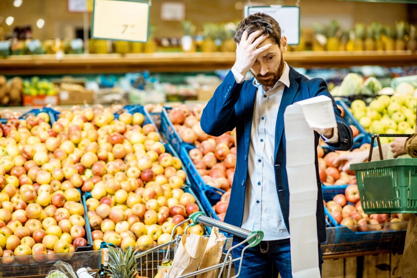 Man with shopping list in the supermarket