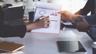 Group of Businesswoman and Accountant checking data document on
