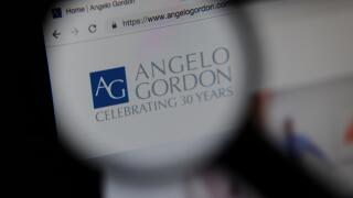The Angelo Gordon financial website seen through a magnifying glass