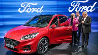 Frankfurt 12.Sept.2019: German Chancellor Angela Merkel visits Ford booth at IAA. From left.: Anglea Merkel, VDA President Bernhard Mattes, Ford Germany boss Gunnar Herrmann, the car is a Ford Kuga Hybrid.   ---   Frankfurt/M 12.9.2019: Bundeskanzlerin An