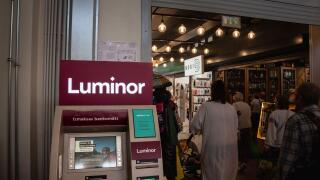 Picture of a sign with the logo of Luminor on an ATM in Riga, Latvia. Luminor Bank AS is a bank headquartered in Tallinn, Estonia, with branches in La