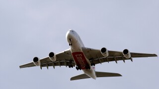 Emirates Airways new Airbus A380 long haul passenger aircraft prepares to land at London's Heathrow Airport