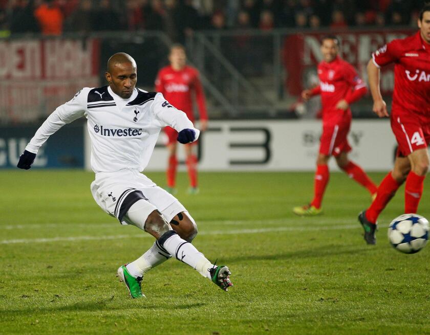 Tottenham Hotspur's Jermain Defoe scores against FC Twente during their Champions League Group A soccer match in Enschede December 7, 2010. REUTERS/Michael Kooren (NETHERLANDS - Tags: SPORT SOCCER)