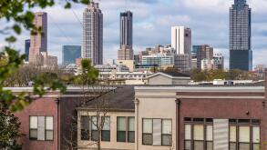 Atlanta, Georgia skyline beyond urban residential area on the east side of the city. (USA)