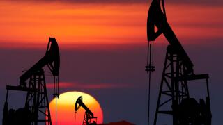 Oil pumps silhouette at colorful sunset