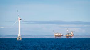Wind Turbine Generators of the Beatrice Demonstration Project and Beatrice A oil platform in the Moray Firth, Scotland