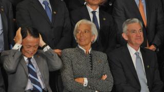 Buenos Aires, Argentina. 21st July, 2018. Finance Minister of Japan Taro Aso, Managing Director of the International Monetary Fund Christine Lagarde and Chairman of the Federal Reserve Jerome Powell during the Official family photo of the G20 3rd Meeting 