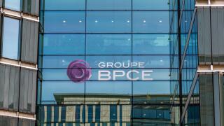 Sign on the facade of a building belonging to the French banking group BPCE, resulting from the merger of Banque Populaire and Caisse d'Epargne