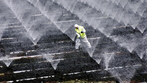 A sewage treatment operator carries out essential cleaning and  maintainance work