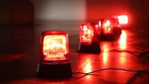 Background with big red flashing alarm lights.