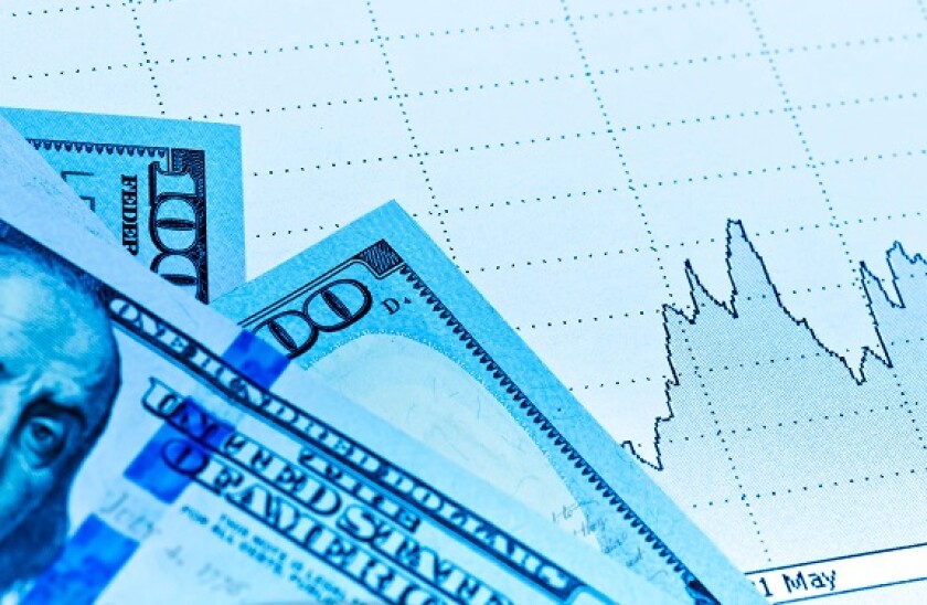 Currency market concept paper chart graph. Toned in blue