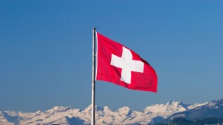 Swiss flag and Alps