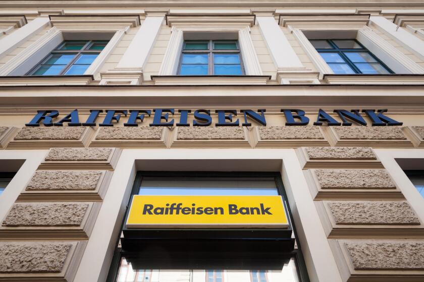 SZEGED, HUNGARY, JULY 3, 2018: Raiffeisen logo on their main bank in the center of Szeged. Raiffeisen is an Austrian bank, massively investing in Cent