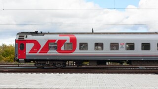 Russian train carriage. Logo of Russian Railways (RZhD). Third-class sleeper wagon