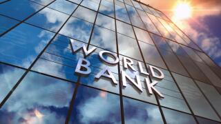 World Bank on glass building. Mirrored sky and city modern facade. Global capital, business, finance, economy, banking and money concept 3D rendering