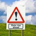 Financial concept warning of interest rates rise ahead sign England UK