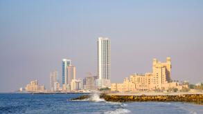 View of skyline along corniche waterfront of  Ajman emirate in United Arab Emirates