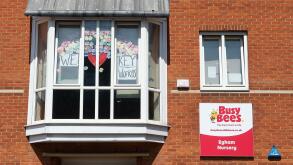 Egham, Surrey, UK. 20th May, 2020. A large 'We love you key workers' rainbow in the window of the Busy Bees Nursery in Egham, Surrey during the Coronavirus Covid-19 Pandemic lockdown. Credit: Maureen McLean/Alamy