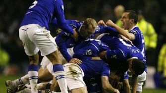 Everton players pile on top of goalscorer Dan Gosling after he scores his sides first goal of the game