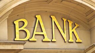 Gold Bank sign at the entrance to a Banking institute in the centre of the financial sector