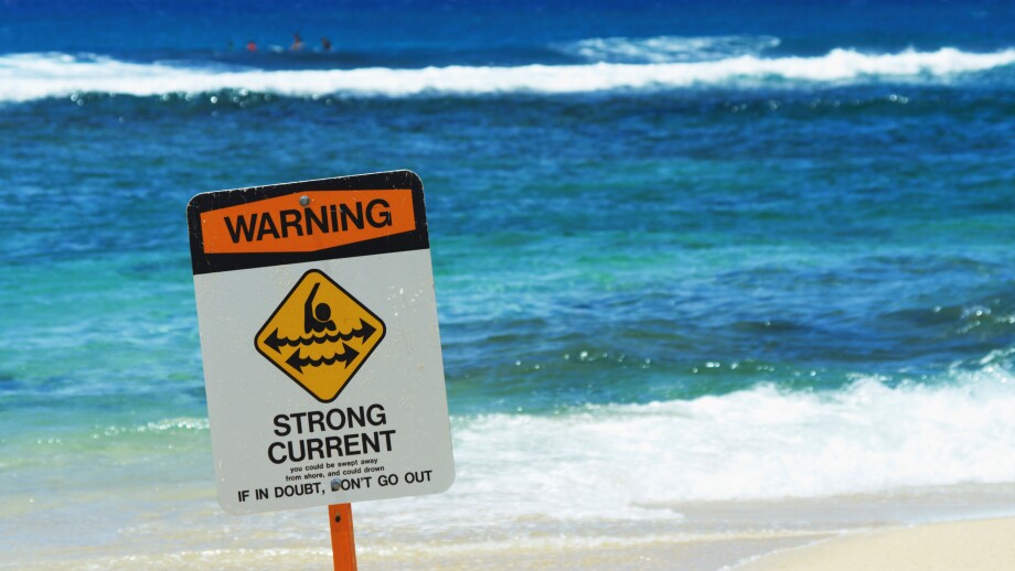 Strong current warning sign at Poipu Beach Park Kauai HI