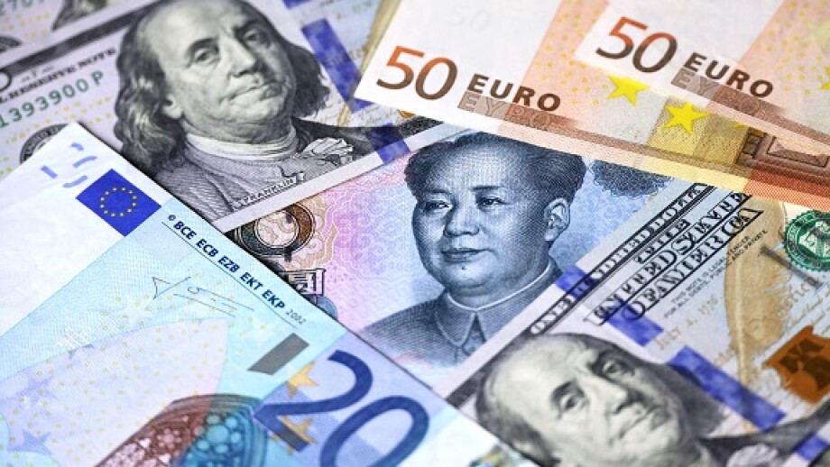 Chinese yuan surrounded with US dollars and Euro banknotes. Concept of trade war between the China and USA, exchange rate, global economy