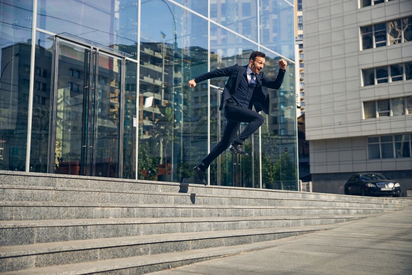 Happy brunette male jumping down in hurry