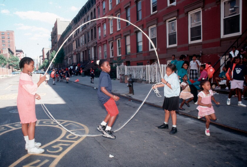 Young girls practice their double dutch skills on a Harlem play street. Image shot 1994. Exact date unknown.