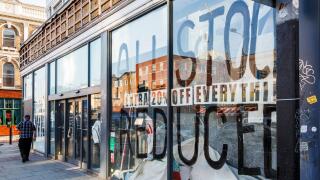 A man walks past a closing down store on Camden High Street during the coronavirus pandemic lockdown, London, UK