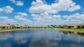 Houses around small lake in housing development in North Port Florida