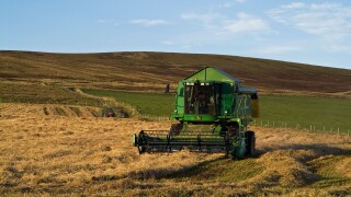 dh combine harvester HARVESTING UK John Deere Combine harvester cutting barley Orphir Orkney harvest fields scotland machinery farm machine. Image shot 2007. Exact date unknown.