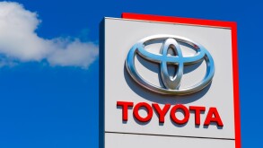 Toyota logo on car dealership sign.