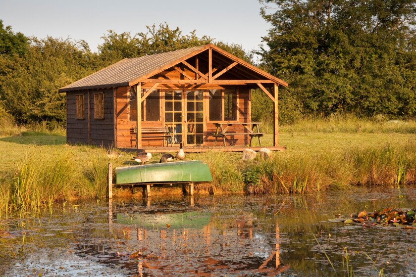 A summerhouse beside a lake, Wiltshire, England