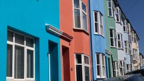 A terrace of brightly painted houses in Brighton, UK