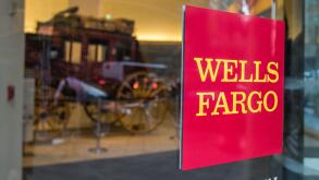 A Wells Fargo sign on a revolving door of one of their branches in Manhattan.