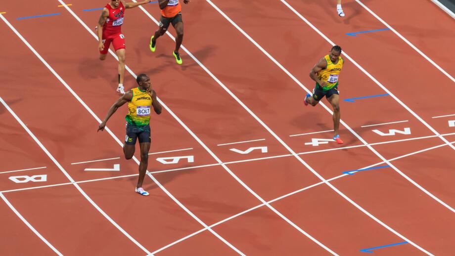 Usain Bolt crosses line with finger to lips, looks at Yohan Blake, Men's 200m final, London 2012, Olympic Games, London, UK