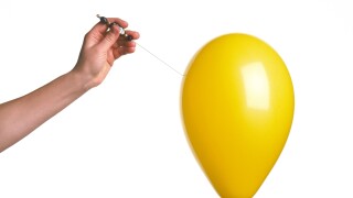 yellow balloon with hand cut out on white background