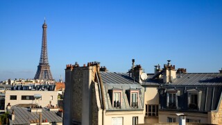 Eiffel Tower across roof tops in Paris, France