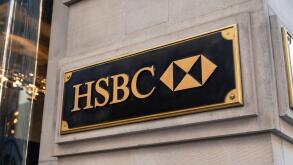 HSBC logo on a wall in New York. HSBC Holdings is a British multinational banking and financial services company headquartered in London, United Kingd