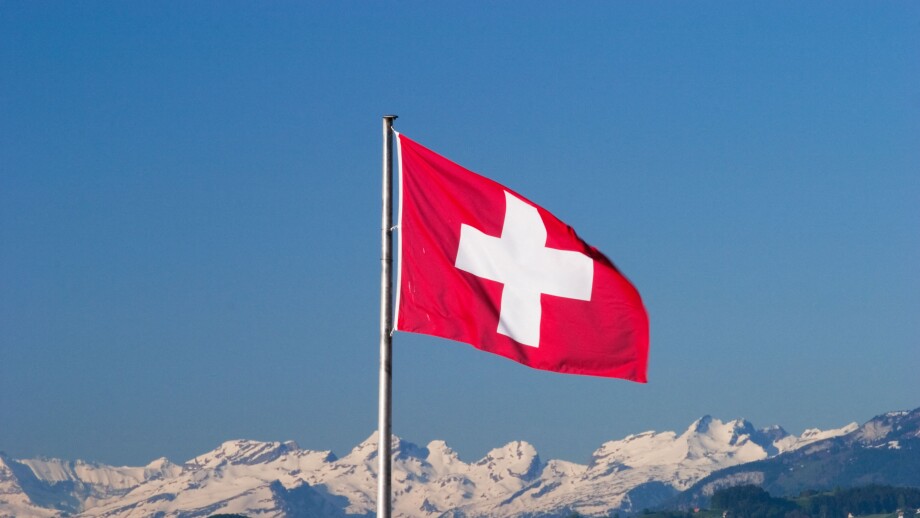 Swiss flag and Alps