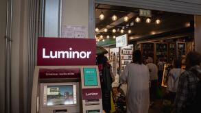 Picture of a sign with the logo of Luminor on an ATM in Riga, Latvia. Luminor Bank AS is a bank headquartered in Tallinn, Estonia, with branches in La