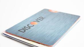 Vidalia, Georgia / USA - June 29, 2019: A close-up studio shot of one of Discover credit cards set on a plain white background.