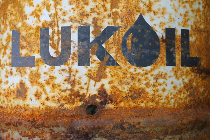 Lukoil company logo on a rusty barrel. Yamal, RUSSIA