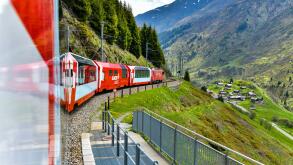 Zermatt 24,5,2023: Glacier Express red swiss train in Swiss Alps.Zermatt to St.Moritz. Switzerland in summer