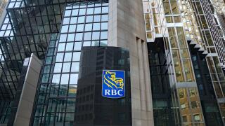 TORONTO - OCTOBER 2019:  The logo of RBC, Canada's largest banking company, on its modern head office building in Toronto's financial district.