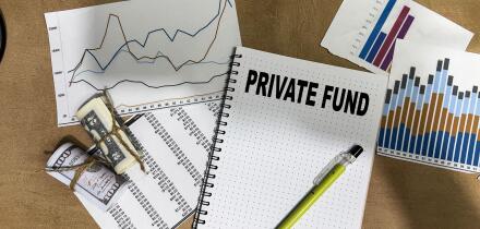 Concept of Private Fund write on book isolated on Wooden Table.