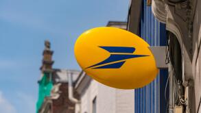 Lille, France - 15 June 2018: Logo of La Poste, French national postal service on Rue Nationale.