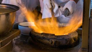 Wok cooking, flash in the pan, fire flames