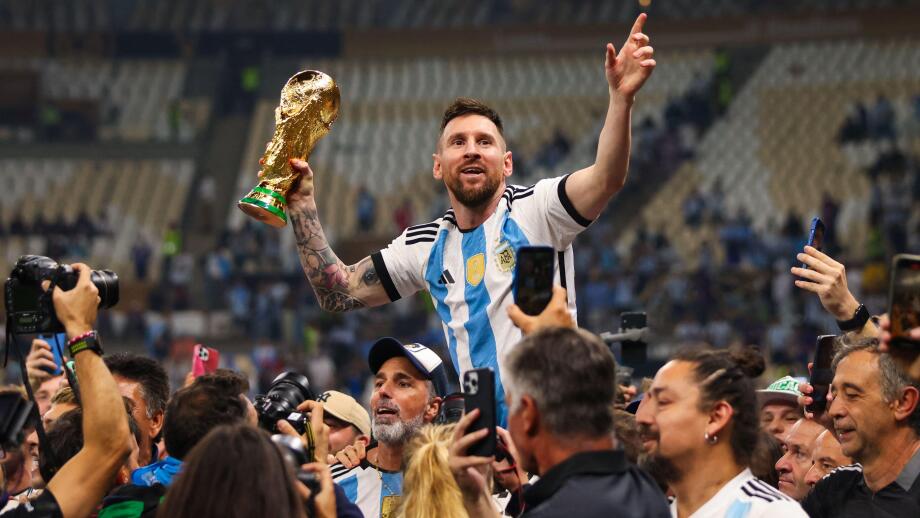 LUSAIL CITY, QATAR - DECEMBER 18: Lionel Messi celebrates with the World Cup Trophy after the FIFA World Cup Qatar 2022 Final match.